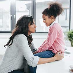 mother talking to child to alleviate fear of coronavirus